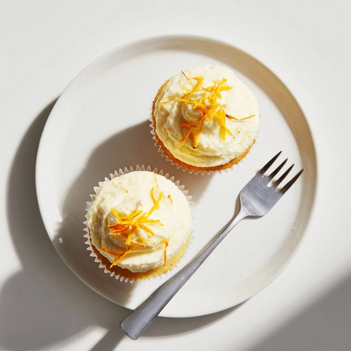 Delicate floral cupcakes with light orange blossom water flavor and smooth buttercream for spring desserts