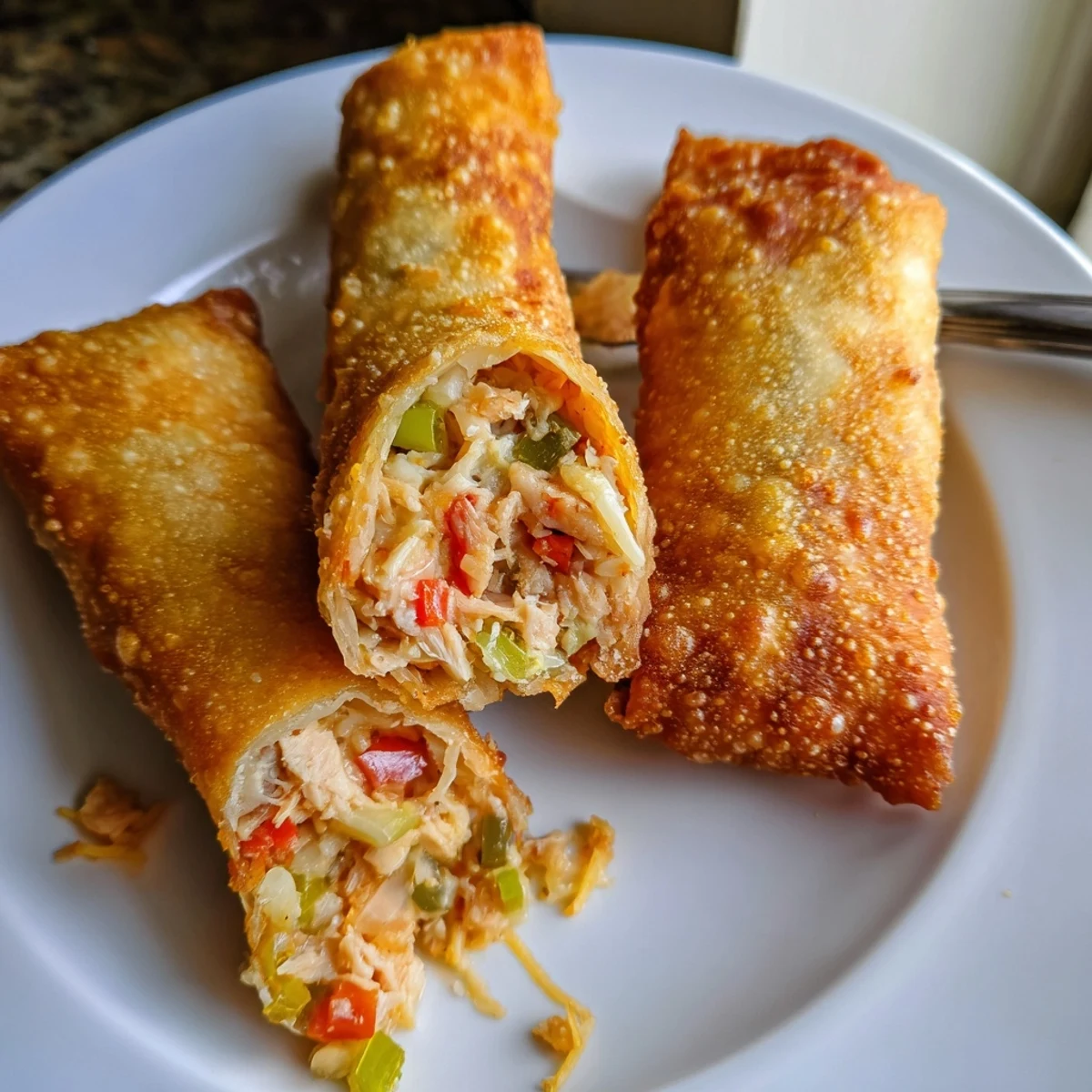 Crispy fried Voodoo Egg Rolls filled with smoky andouille sausage and melted cheddar