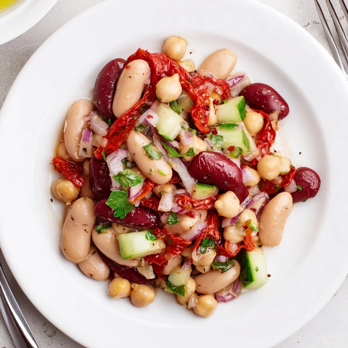 Chilled or room temperature Dense Bean Salad With Sun Dried Tomatoes, olive sheen.
