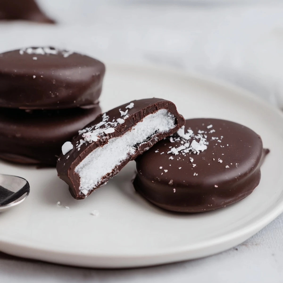 Peppermint Patties on parchment, glossy dark chocolate coating and bright mint filling