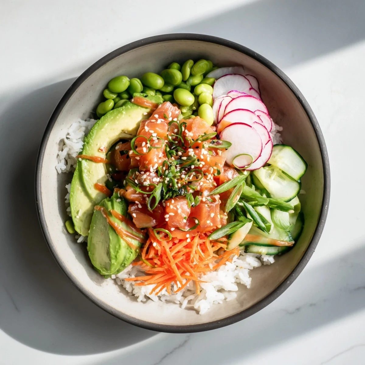 Gourmet Hawaiian-style salmon and avocado poke bowl topped with sesame seeds and crisp veggies