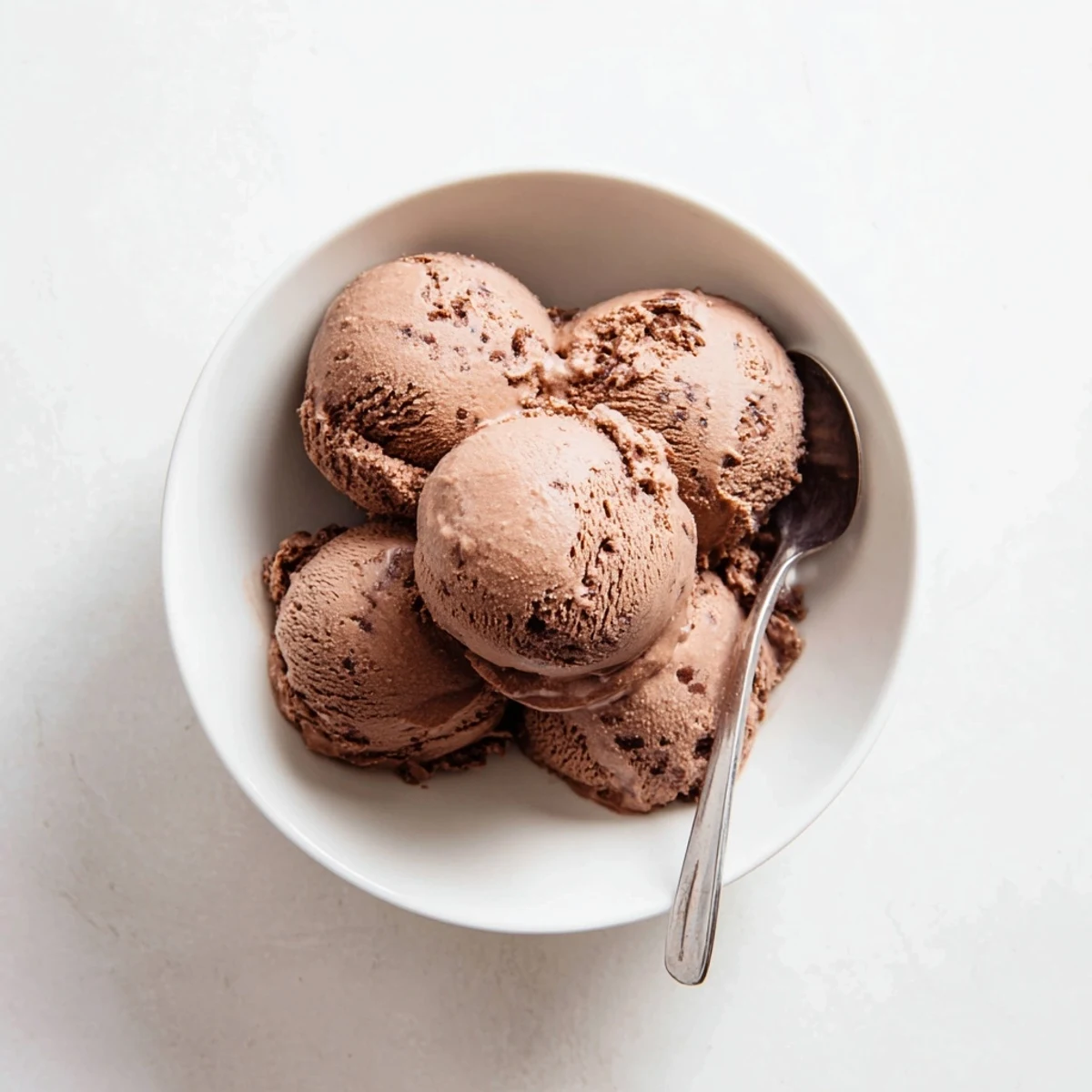 Rich chocolate sourdough ice cream swirl garnished with fresh berries and a sprinkle of sea salt