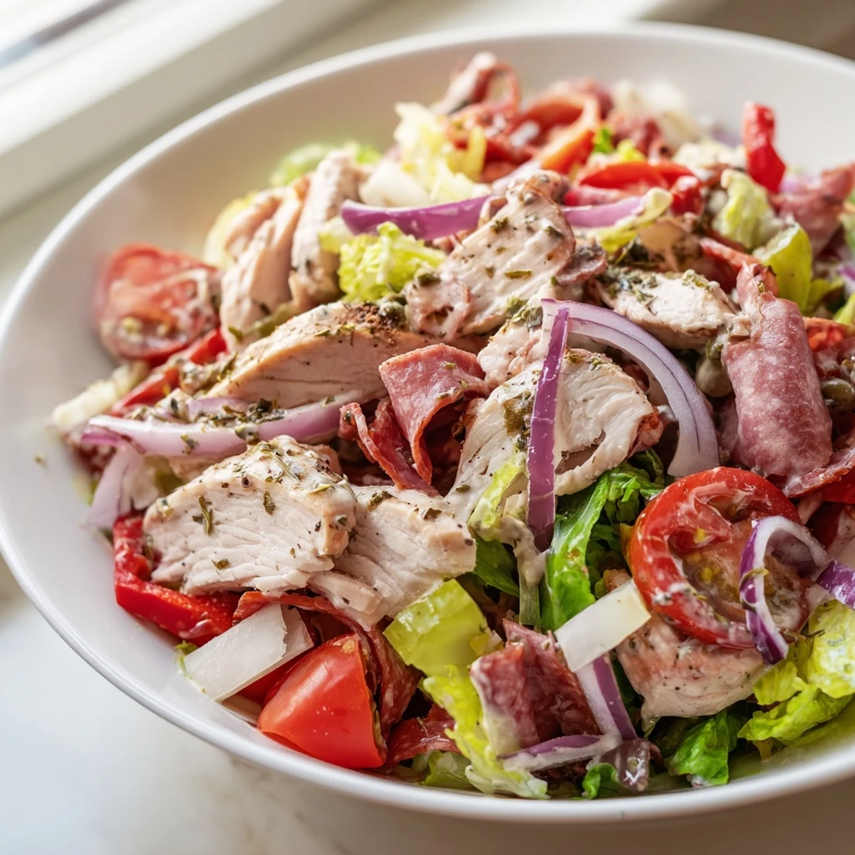 Italian Grinder Chicken Salad featuring tender grilled chicken, pepperoncini, and a creamy Italian dressing